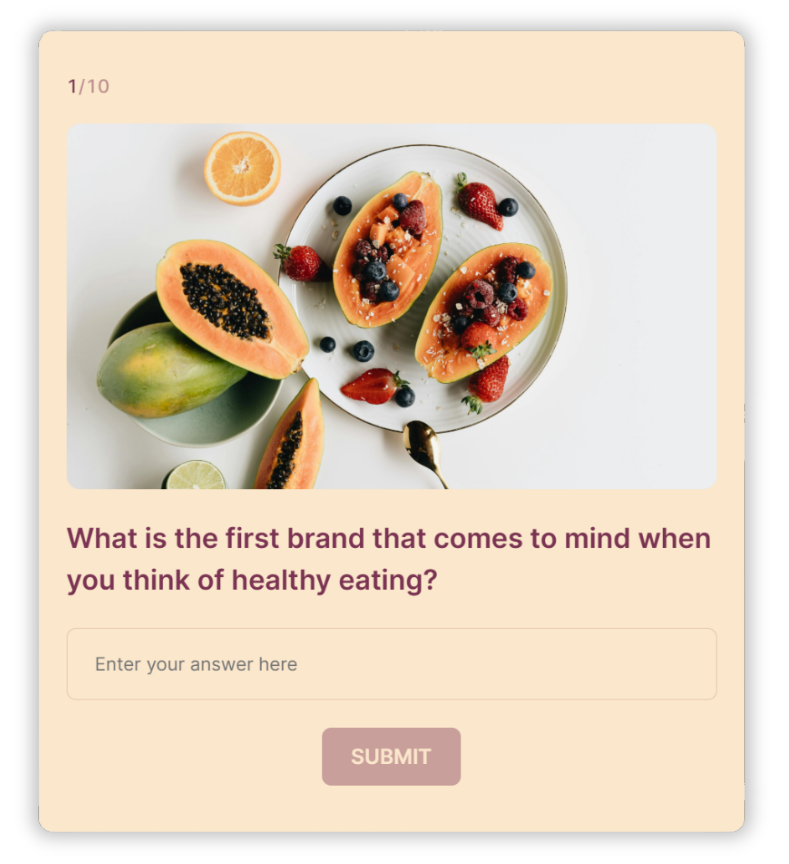 A brand awareness survey created with Opinion Stage. The question on screen asks: “What is the first brand that comes to mind when you think of healthy eating?” with a text box for responses and a submit button. The design features a photo of fresh fruits on a plate.